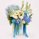 luxury blue-and-white fresh floral bucket featuring an impressive banknote fan and a handcrafted fresh jasmine garland