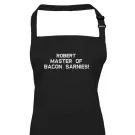 Black apron embroidered with "ROBERT MASTER OF BACON SARNIES!".