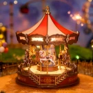A miniature wooden carousel with red and white striped canopy, detailed horses, and intricate railings, lit from within.