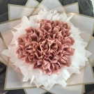 Money bouquet made of folded Thai Baht bills, shaped like roses.