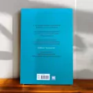 Back cover of "Omoidori Ni Hito Wo Ugokasu Yabai Hanashikata" book in Thai, with text and WE LEARN logo.