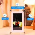 Digital photo frame with a couple's photo, charging and working time information.