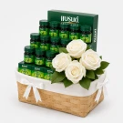 Gift hamper basket with bottles of Brand's Essence of Chicken and white flowers.
