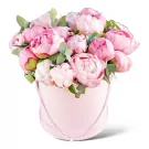 Pink peonies in a round pink box with decorative stitching.