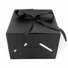 Black luxury box with black ribbon bow and gold handles, showcasing I Love You Fresh Roses.
