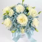 White roses and carnations with blue gypsophila in a white box with a light blue ribbon.