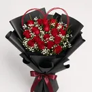 18 fresh red roses, fresh white baby's breath fillers, a handmade heart-shaped twig frame