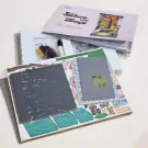 DIY Book Divider kit laid out, showing wooden pieces, instructions, and assembly components.