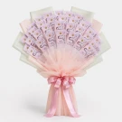 Bouquet of Thai baht banknotes wrapped in pink and white paper, tied with a pink ribbon.