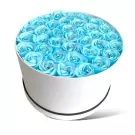Round white box filled with 40 light blue artificial roses, each with a diamond center.
