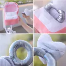 Pink plush ring box with a heart-shaped pillow inside and silver ring elements.