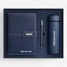 Navy blue notebook, pen, and thermos tumbler gift set, personalized with white text.
