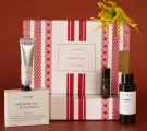 Gift set with "Yahn" branding: hand cream, soap, rollerball, and body oil.