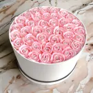 Round white box filled with 40 pink artificial roses, each with a diamond accent.