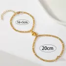 Two gold chain bracelets with magnetic half-heart charms, labeled "16+5cm" and "20cm".