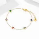 Gold chain bracelet with six colorful gemstones: green, purple, red, blue, and two light blue.