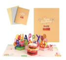 Pop-up birthday card with "Happy Birthday" text, a cake, balloons, and gifts.