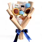 Crochet graduation bouquet with teddy bear, sunflowers, and daisies.