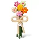 Balloon bouquet with a yellow tulip, colorful balloon daisies, and a beige balloon bow.