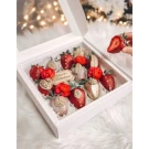 Chocolate-dipped strawberries and red roses in a white gift box with "Happy Birthday" topper.