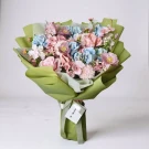 Mix blooms money bouquet with pink and blue artificial flowers wrapped in light green paper.