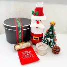 Christmas gift basket with Santa, Christmas tree, Ferrero Rocher, and a gift box.