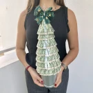 Christmas money tree made of 20 THB banknotes, topped with a star and green ribbon.