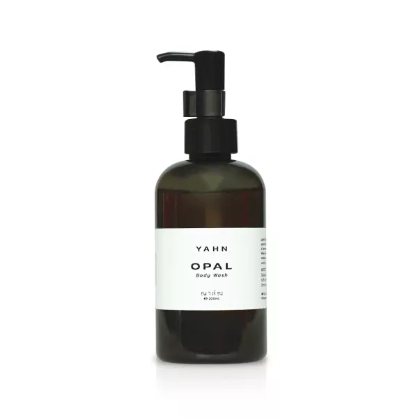 Dark green pump bottle of Yahn Opal Body Wash, with a white label.
