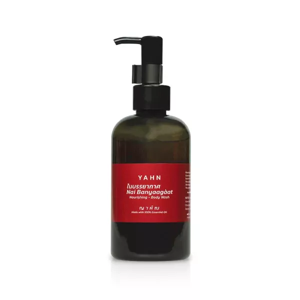 Bottle of Yahn Healing Body Wash with pump dispenser, red label with Thai and English text.