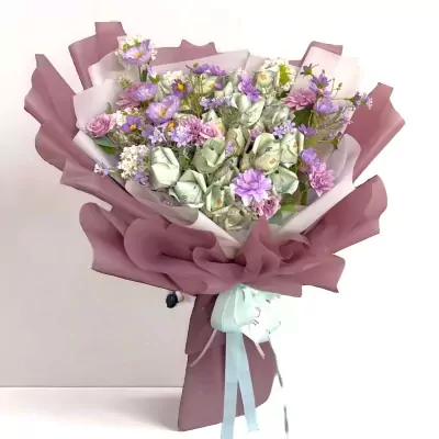 Purple money bouquet with Thai banknotes, purple and pink flowers, and light purple wrapping.