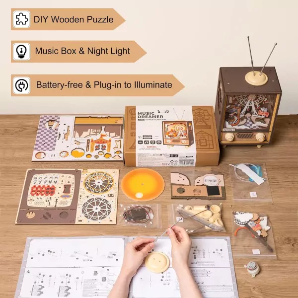 DIY wooden circus music box kit with components, instructions, and assembled model.