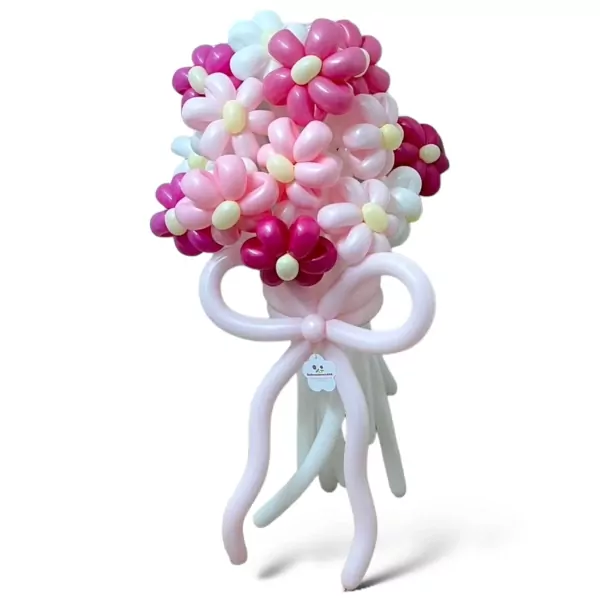 Balloon bouquet of pink, white, and dark pink daisies tied with a pink ribbon.