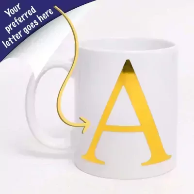 White ceramic mug with a large gold letter 'A' on the front.