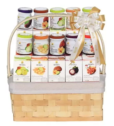 Doi Kham gift basket with assorted fruit juice jars and boxes, tied with a decorative bow.