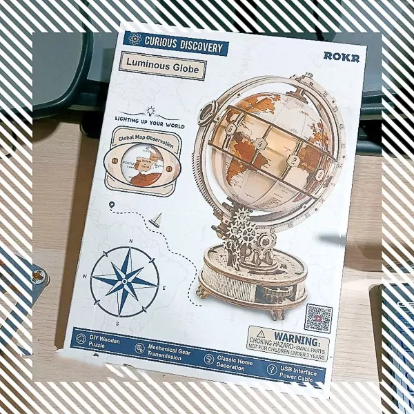 ROKR Luminous Globe DIY kit with wooden parts and globe illustration on packaging.