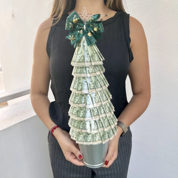 Christmas money tree made of 20 THB banknotes, topped with a star and green ribbon.