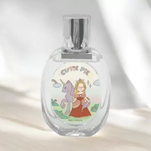 Clear glass perfume bottle with "Cutie Pie" label featuring a princess and unicorn.