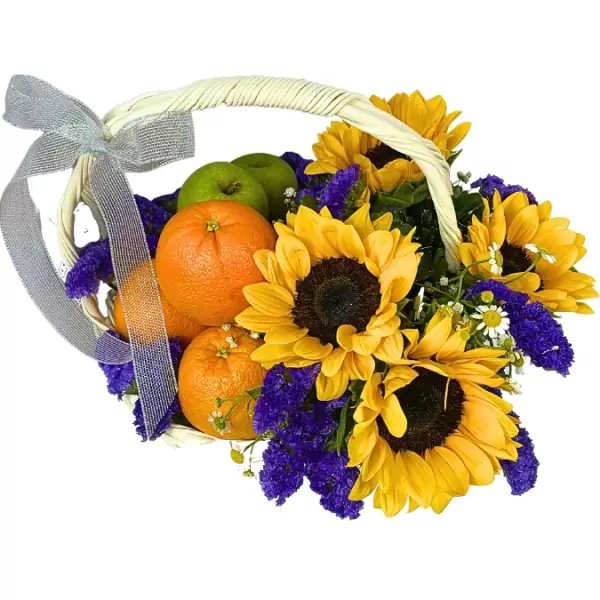 Fruit basket with sunflowers, oranges, green apples, and purple statice, tied with a silver ribbon.