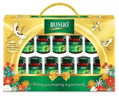 Golden gift box with a dozen bottles of green chicken essence, cranes and floral decorations.