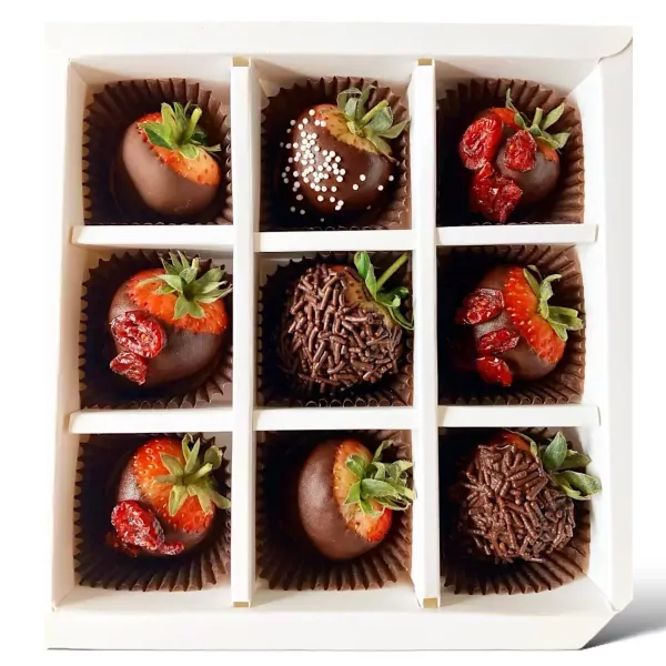 Box of 9 chocolate-covered strawberries with various toppings like sprinkles and dried fruit.