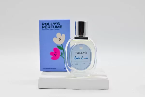 Polly's Perfume Apple Crush bottle and box with floral design.
