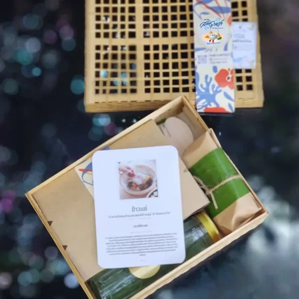 Wooden box with Khao Chae set, featuring a card with food pictures and Thai text.