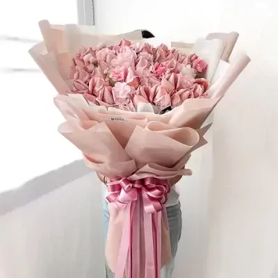 Blush Delight Money Bouquet with pink flowers and ribbon, holding cash shaped into flowers.