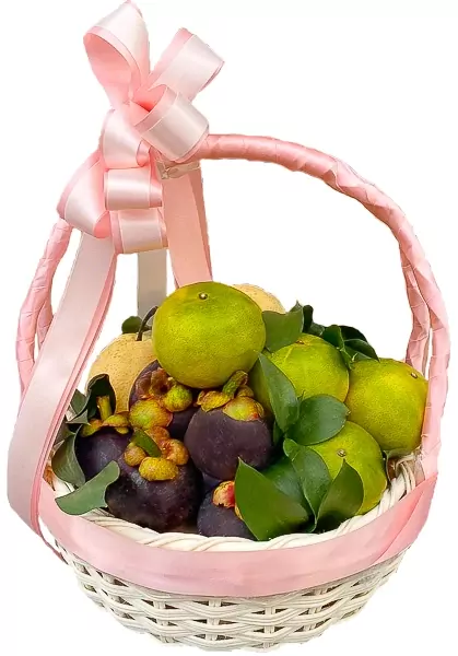 Pink fruit basket with pears, mangosteens, oranges, and green leaves.