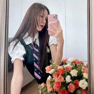 A girl in a school uniform takes a mirror selfie with a bouquet of orange and white carnations.
