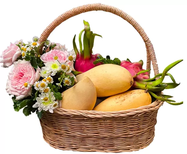 Fruit basket with mangoes, dragon fruits, pink roses, white mums, and daisies.