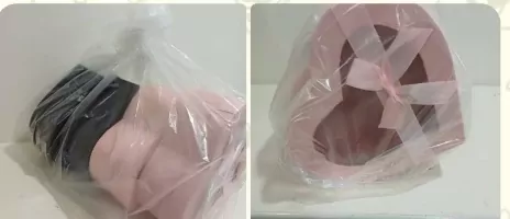 Two heart-shaped boxes: one pink, one black, in clear plastic packaging.