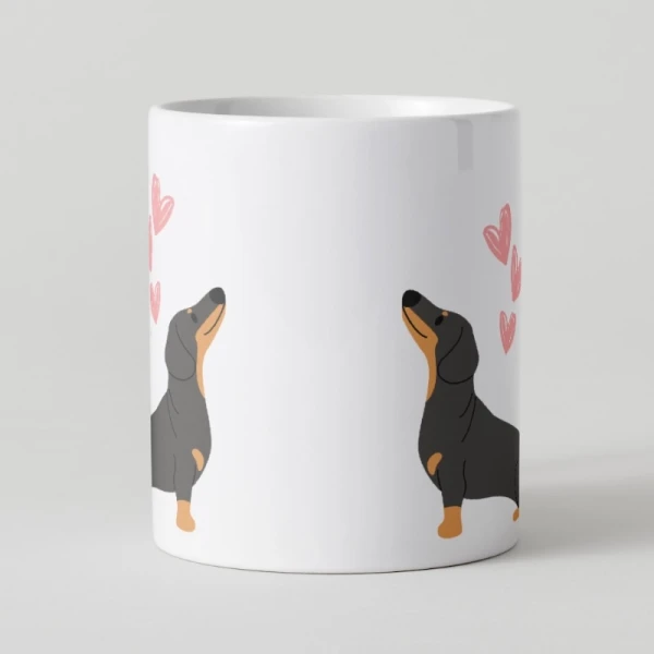 White mug with two black and tan dachshund illustrations and pink hearts.