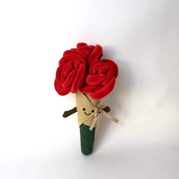 Plush red rose bouquet with a smiling face and arms, wrapped in cream fabric with a green stem.