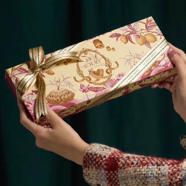 Le Souri Chocolate Gift Box with floral and lemon designs, tied with a ribbon.